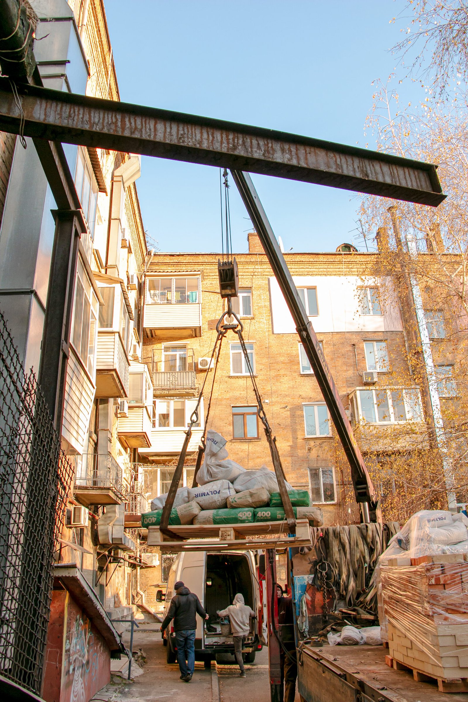 Dnepropetrovsk, Ukraine - 11.24.2021: Loading sandbags for the renovation of an apartment in a five-story building.