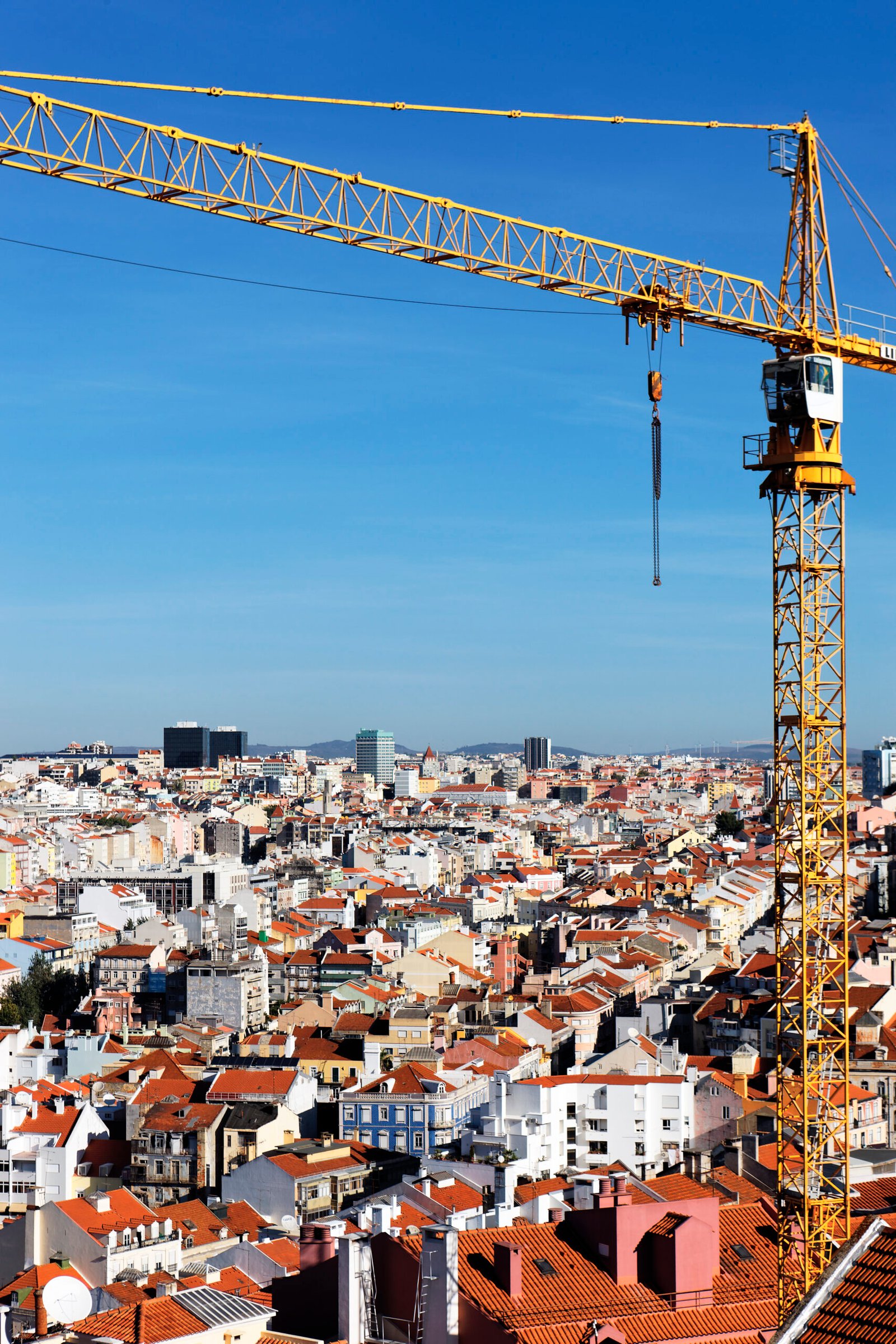 yellow crane on building site in Lisboa